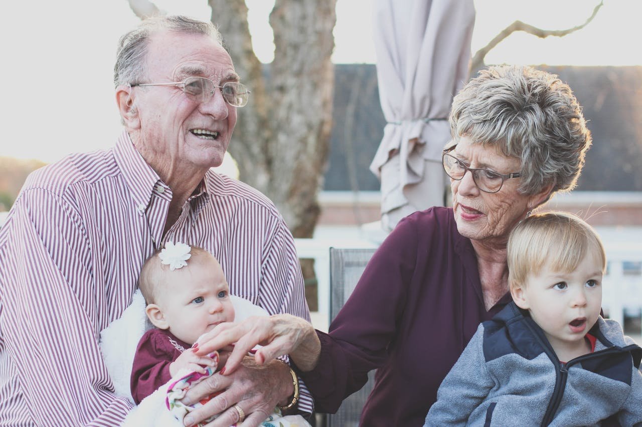 senior couple aging at home with grandchildren